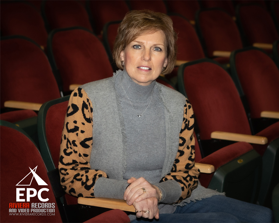 Sharon Harper sitting in a theater seat